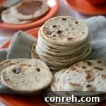 Homemade Sweet Gorditas de Azucar served on vibrant Fiesta Dinnerware Poppy plates
