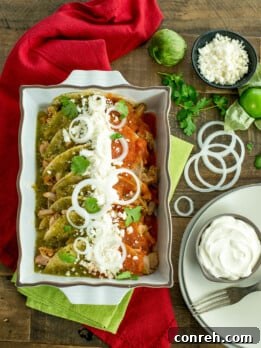 Vibrant Chicken Enchiladas Tricolor arranged beautifully on a plate, showcasing green and red sauces with fresh toppings. This festive dish is perfect for Cinco de Mayo celebrations.