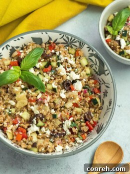 Vibrant Mediterranean Farro Bowl 2 A vibrant Mediterranean Farro Salad in a bowl, showcasing fresh ingredients.