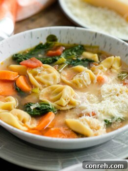 Cheesy Tortellini Vegetable Soup, a quick and easy weeknight dinner idea.