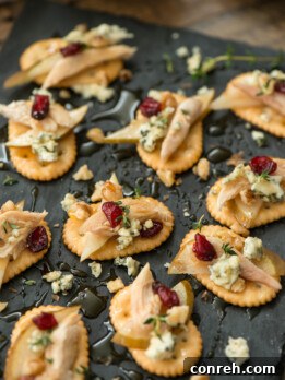 Delicious Pear Blue Cheese Crackers with Honey on a serving tray.