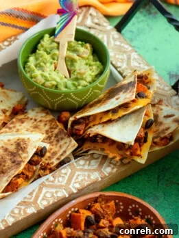Delicious Sweet Potato, Black Bean, and Chorizo Quesadillas arranged on a serving platter.