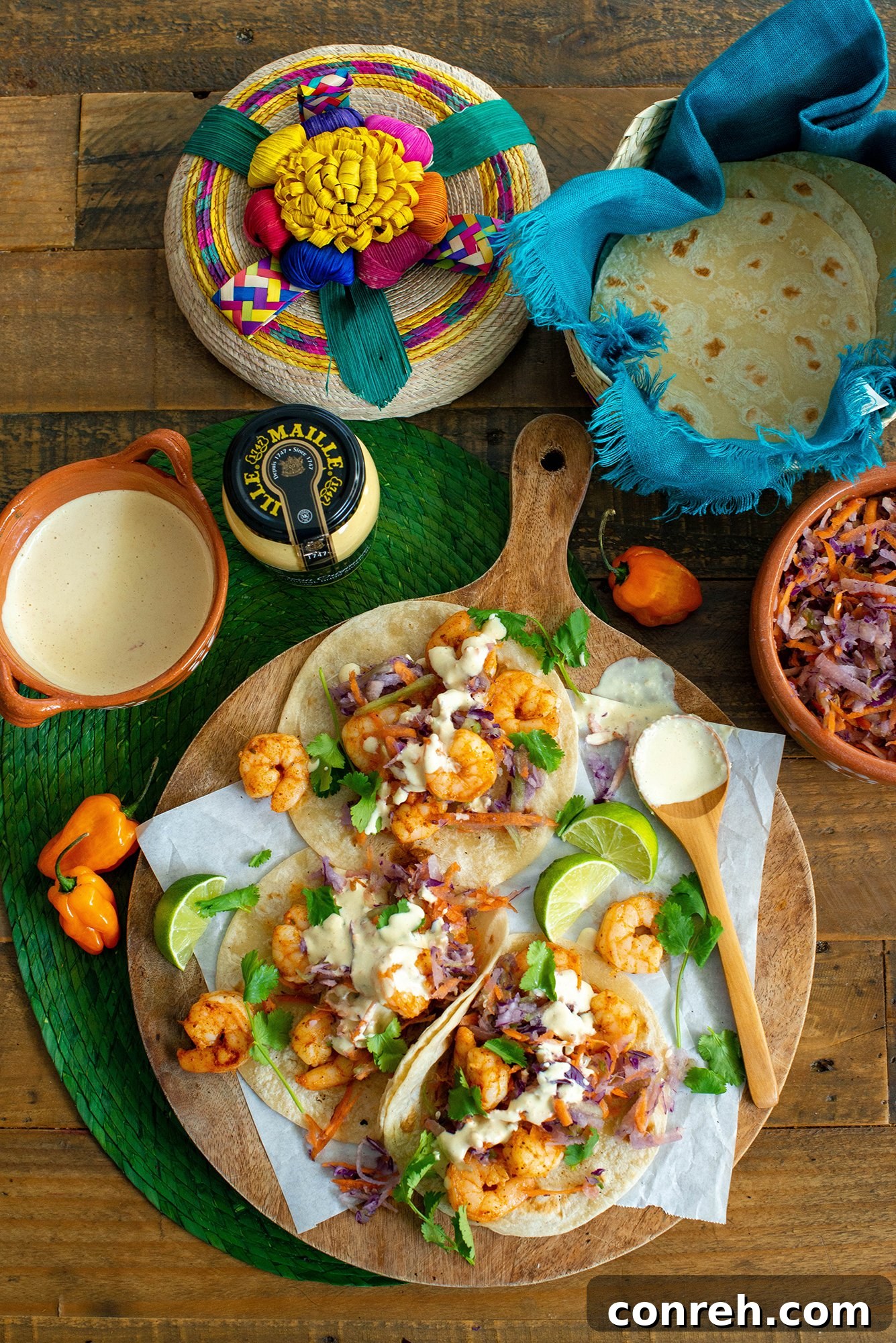 A selection of fresh, crunchy vegetables for taco topping, including jicama, carrots, and cabbage.