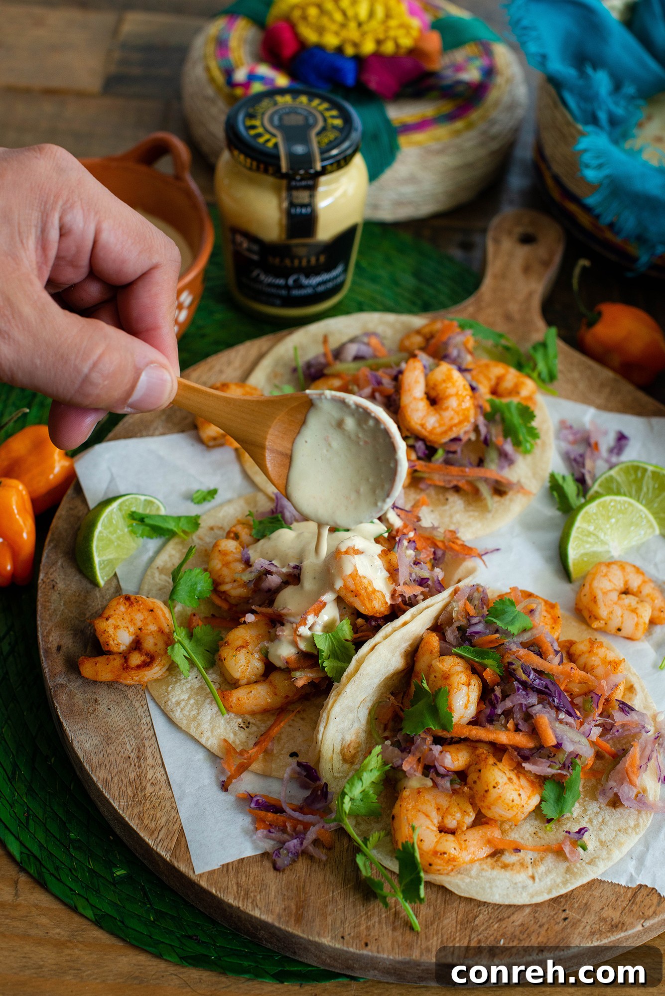 A beautifully presented shrimp taco spread with all the components ready to assemble.