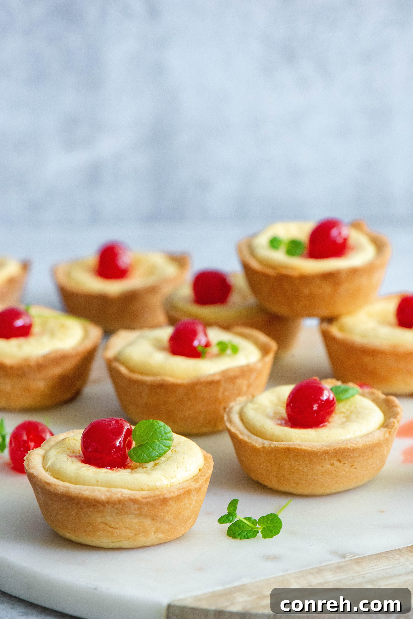 Freshly baked Cubiletes de Queso cooling on a wire rack after coming out of the oven.