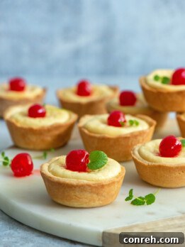 cubilietes de queso with a cherry on top