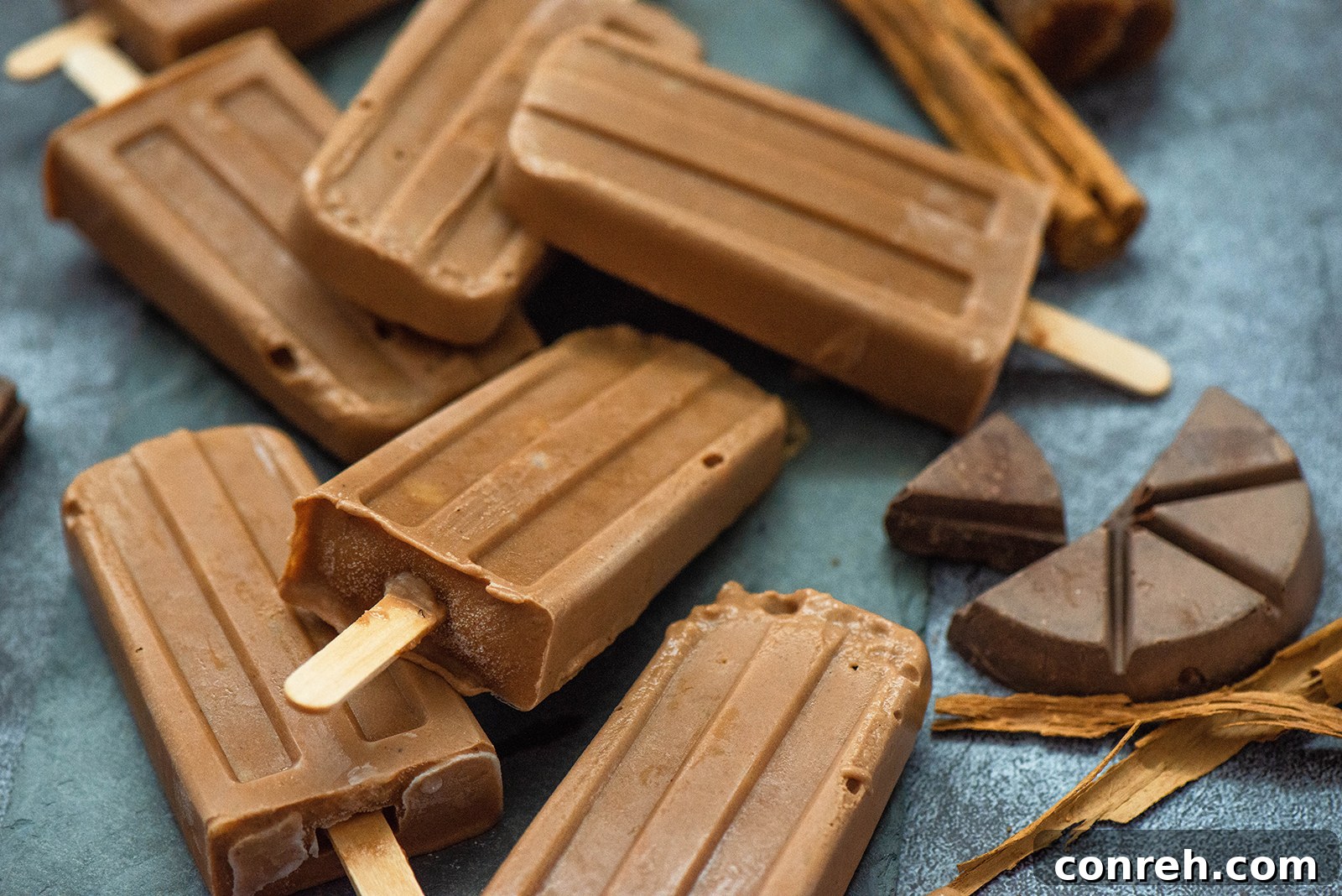 Author Ericka Sanchez holding Aguas Frescas & Paletas book