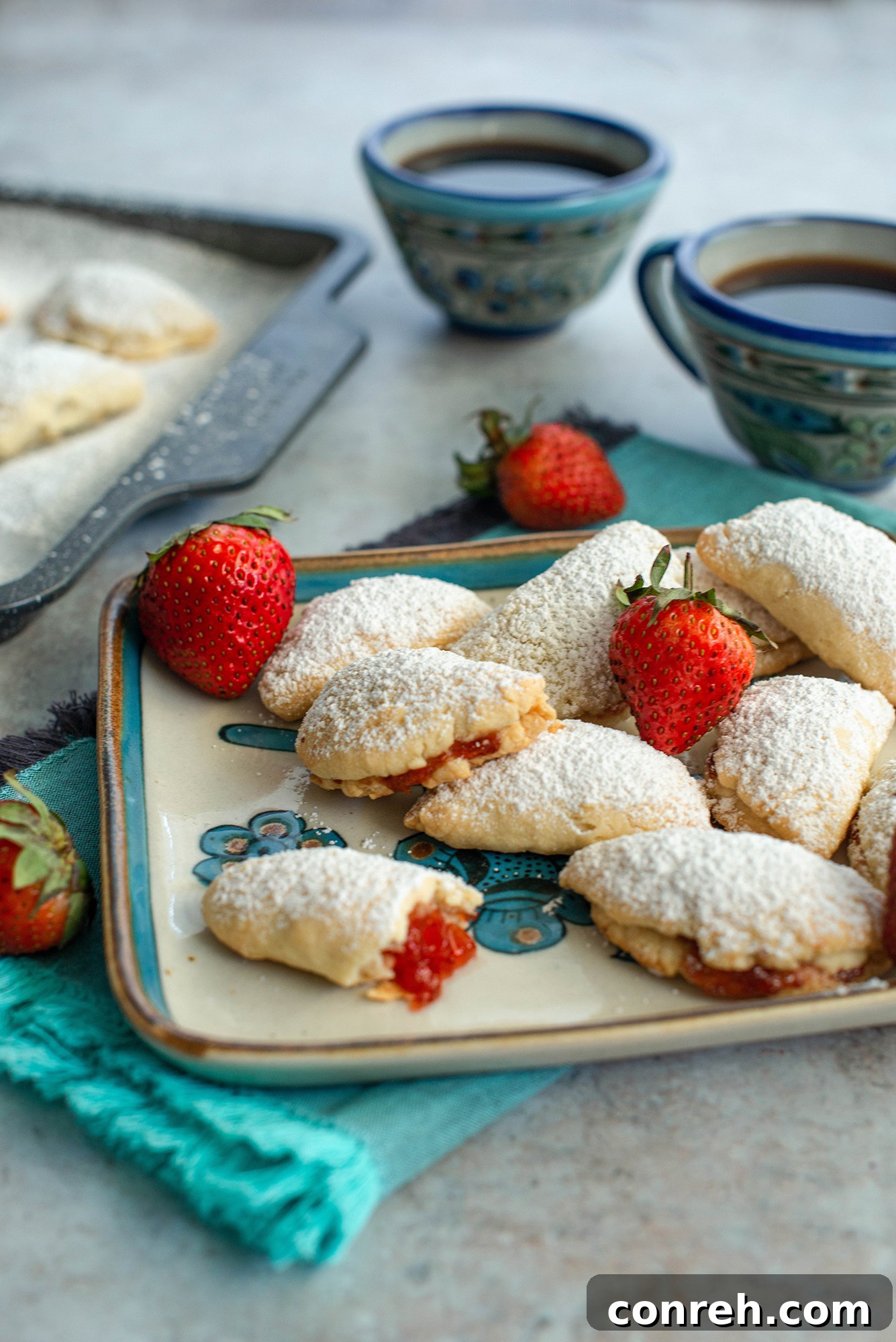 Delicious Mini Strawberry Empanadas, also known as Lunitas de Fresa, elegantly displayed