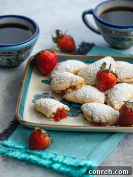 Close-up of baked Lunitas de Fresa with powdered sugar dusting