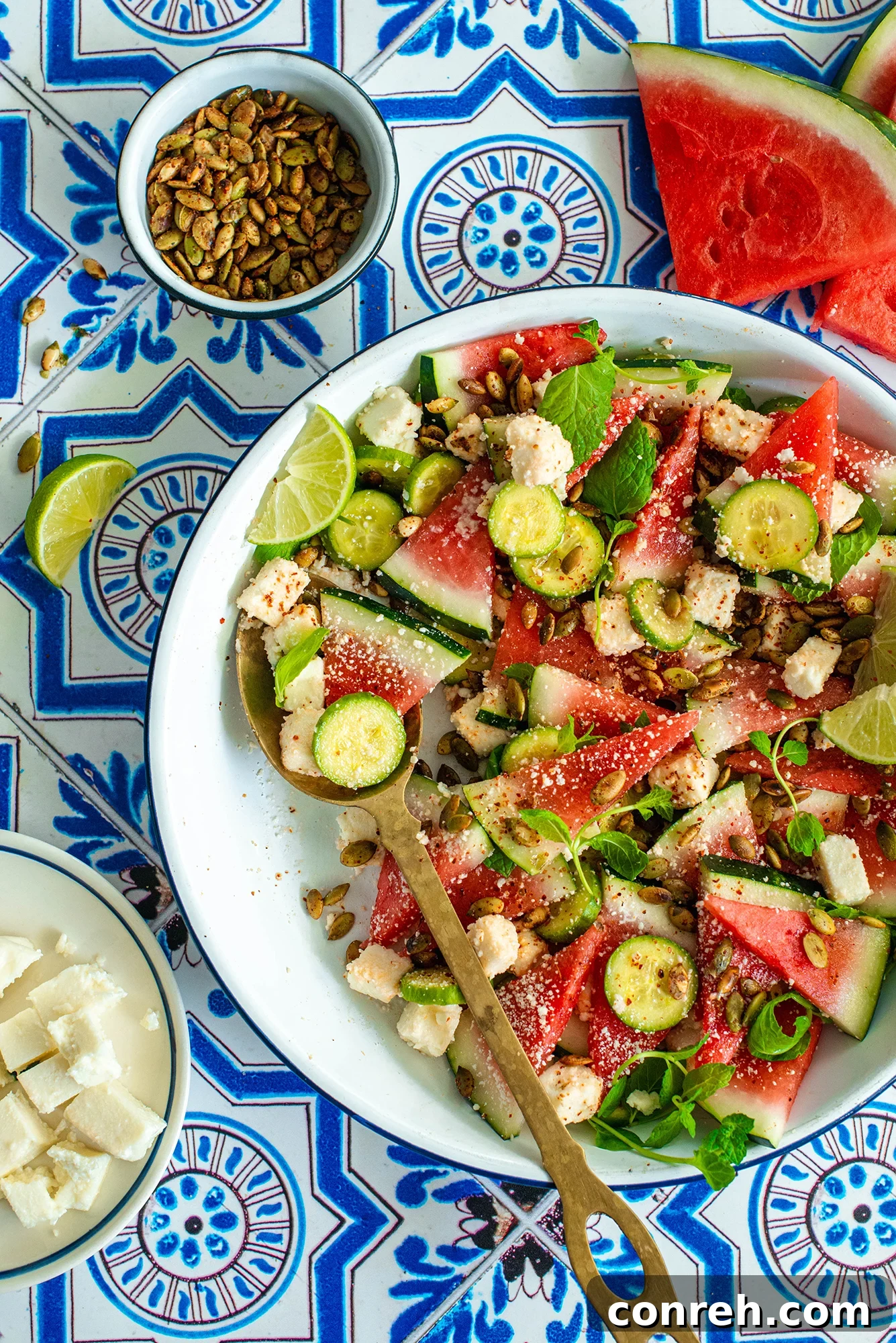Vibrant Watermelon Cucumber Salad with crumbled Queso Fresco and Cotija cheese on a serving platter