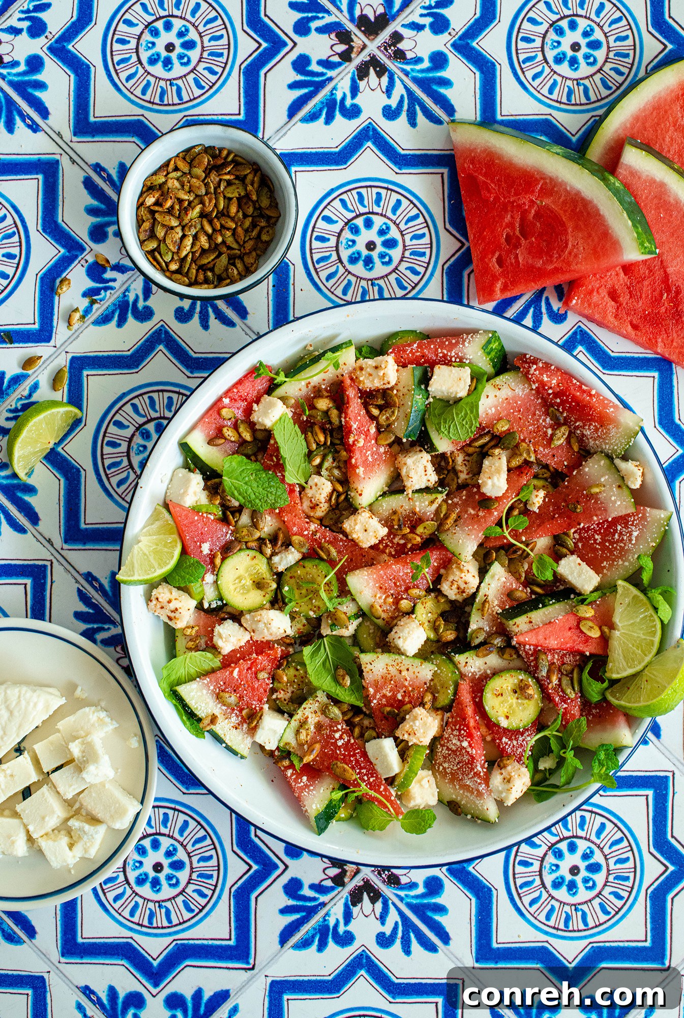 Detailed close-up of Watermelon Cucumber Salad showcasing cheese, mint, and pepitas