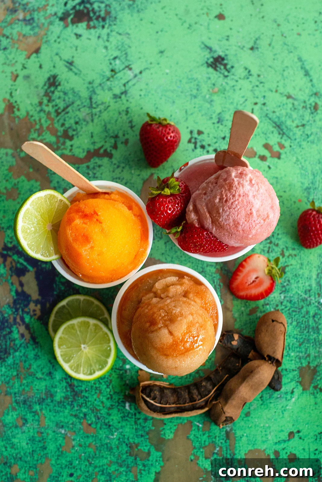 Flavorful Shaved Ice 2 Sabrosa Raspado's refreshing strawberry and cream shaved ice dessert in a clear cup.