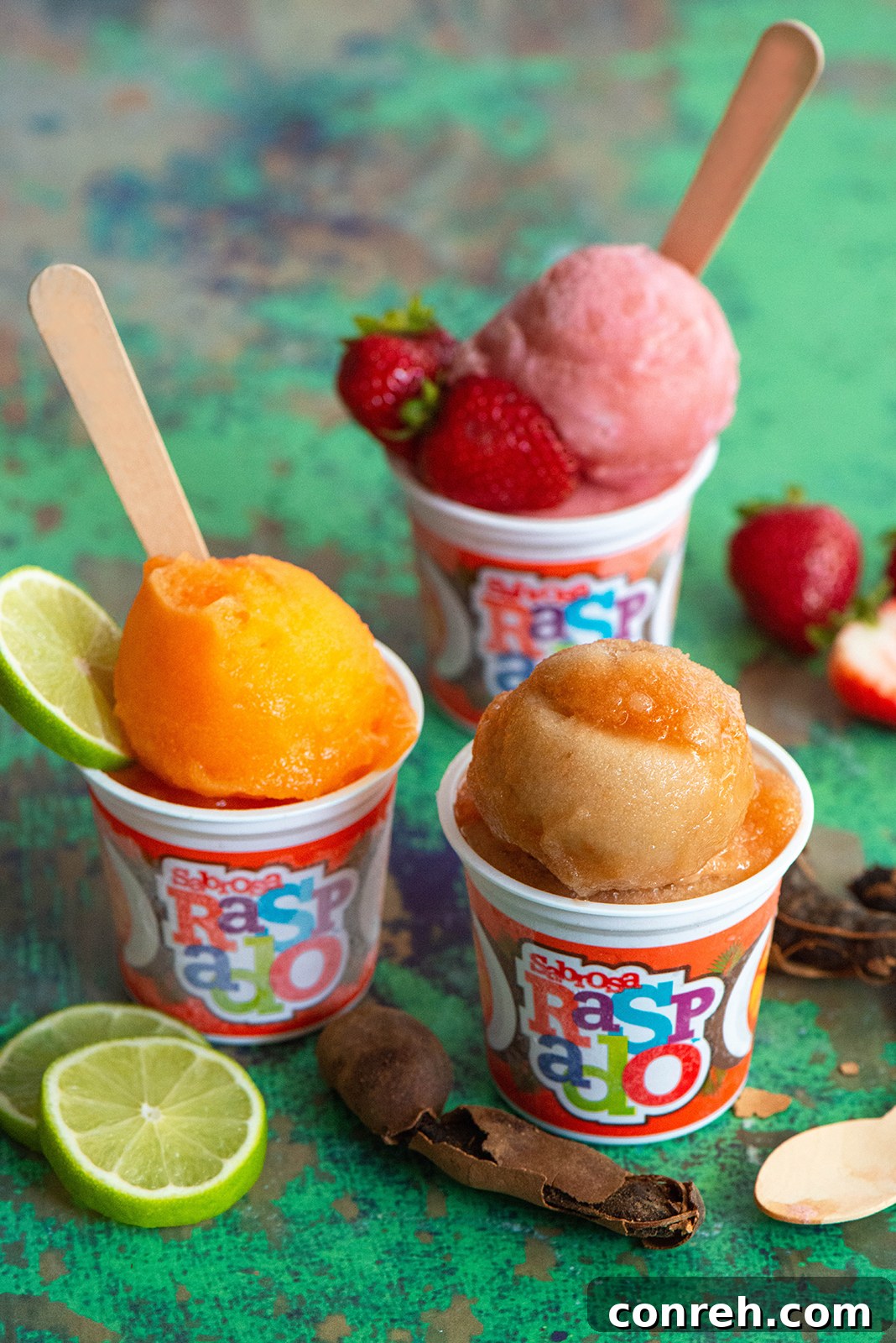 Flavorful Shaved Ice 6 Five Sabrosa Raspado cups neatly arranged in a freezer, showcasing their availability.