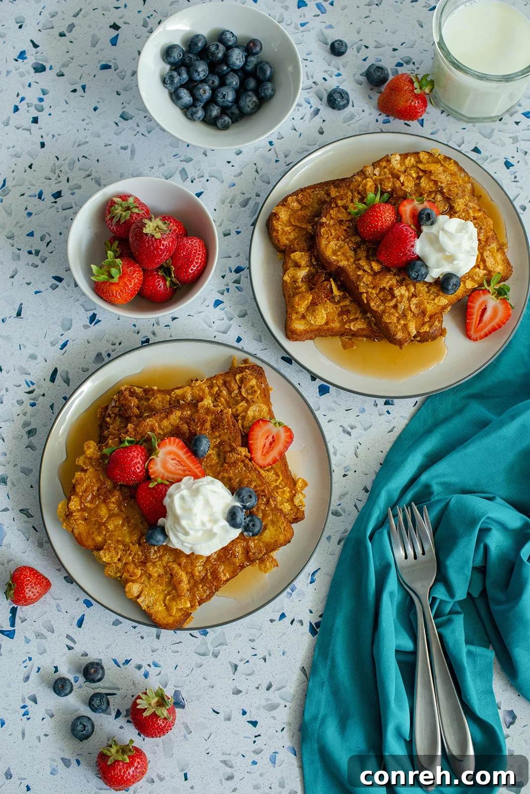 Crispy French Toast coated with cereal, topped with fresh berries
