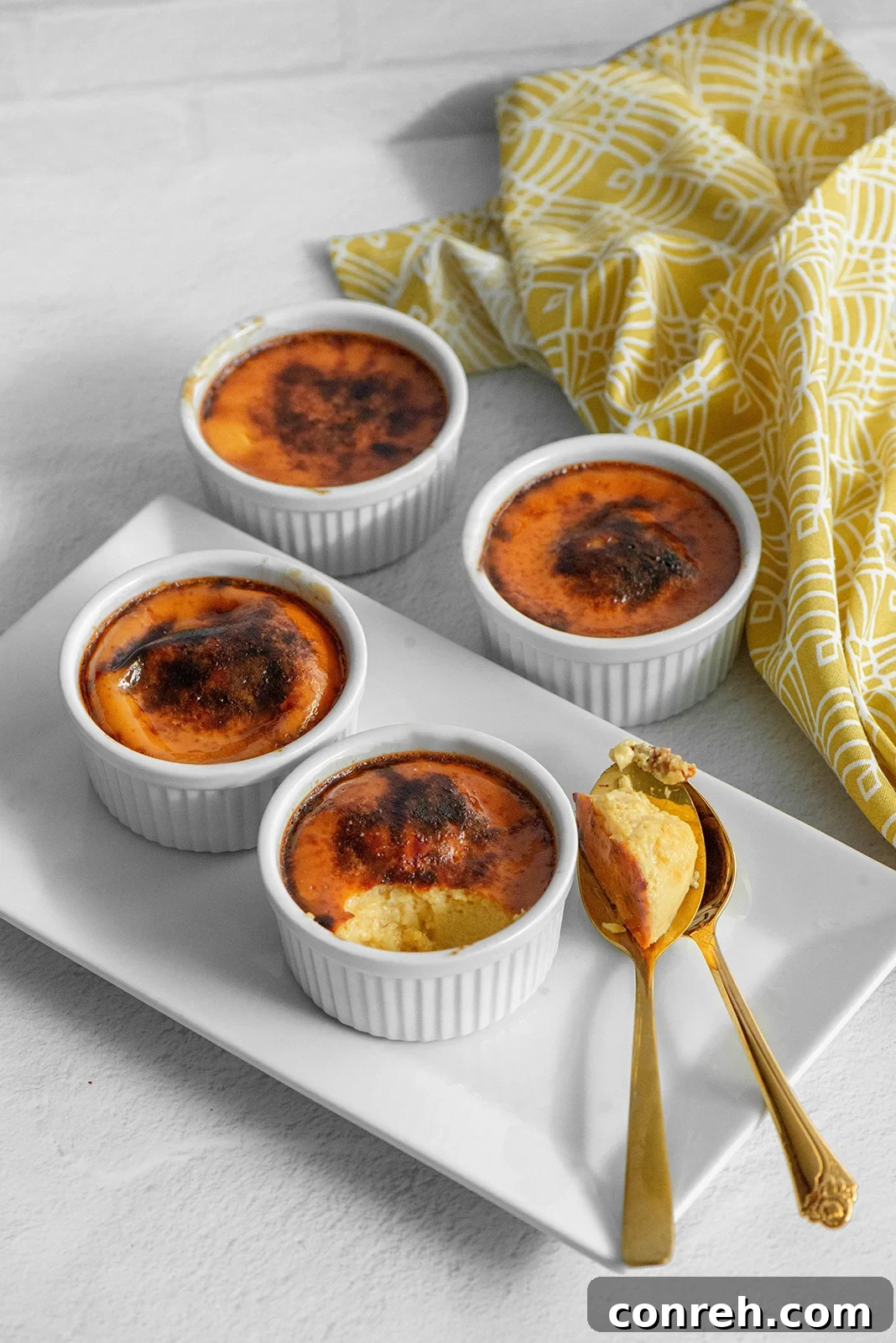 A delicious Jericalla dessert served in a small ramekin, showing its creamy texture and golden brown top.