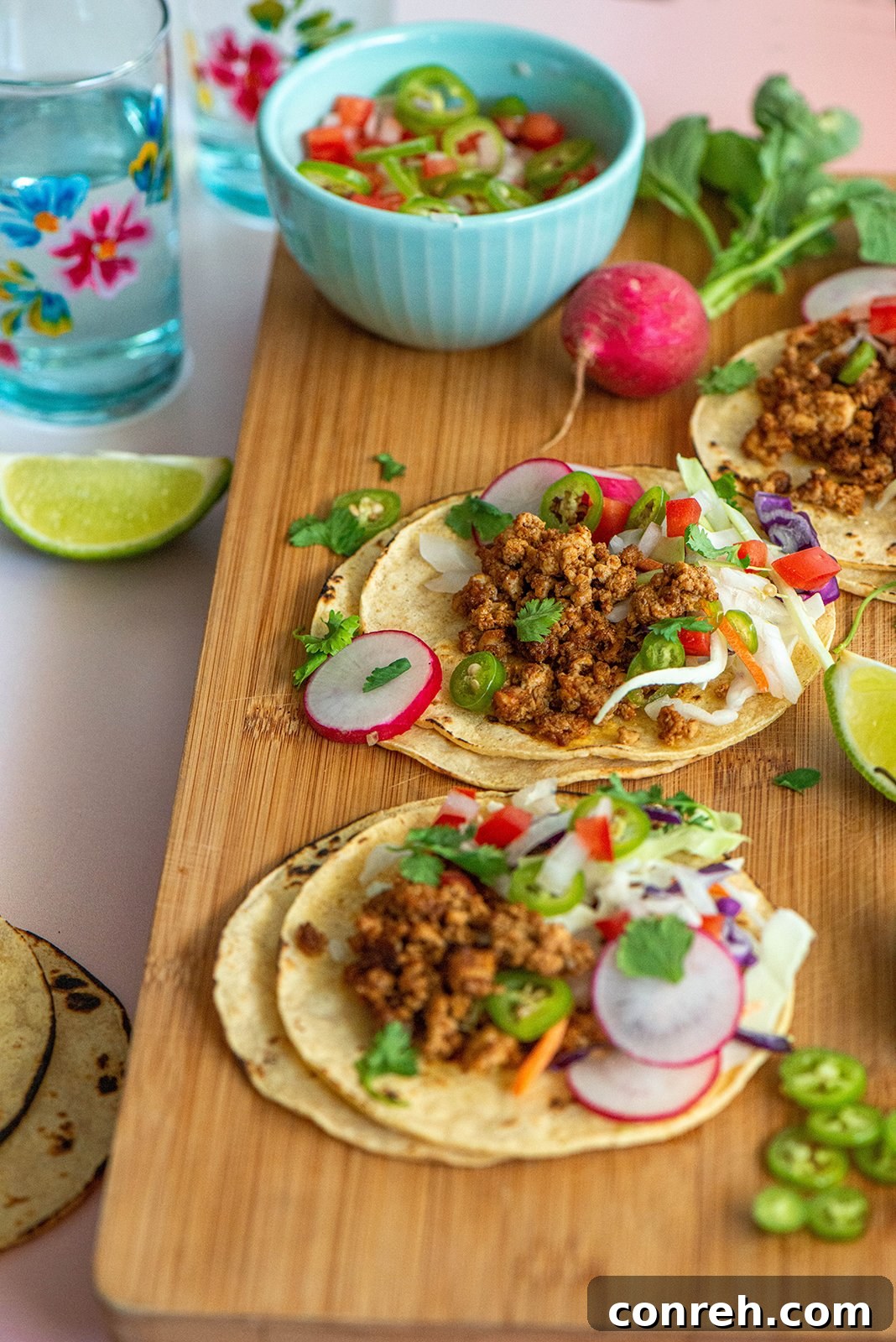Tofu Street Tacos with fresh toppings like radish, cabbage, and cilantro.