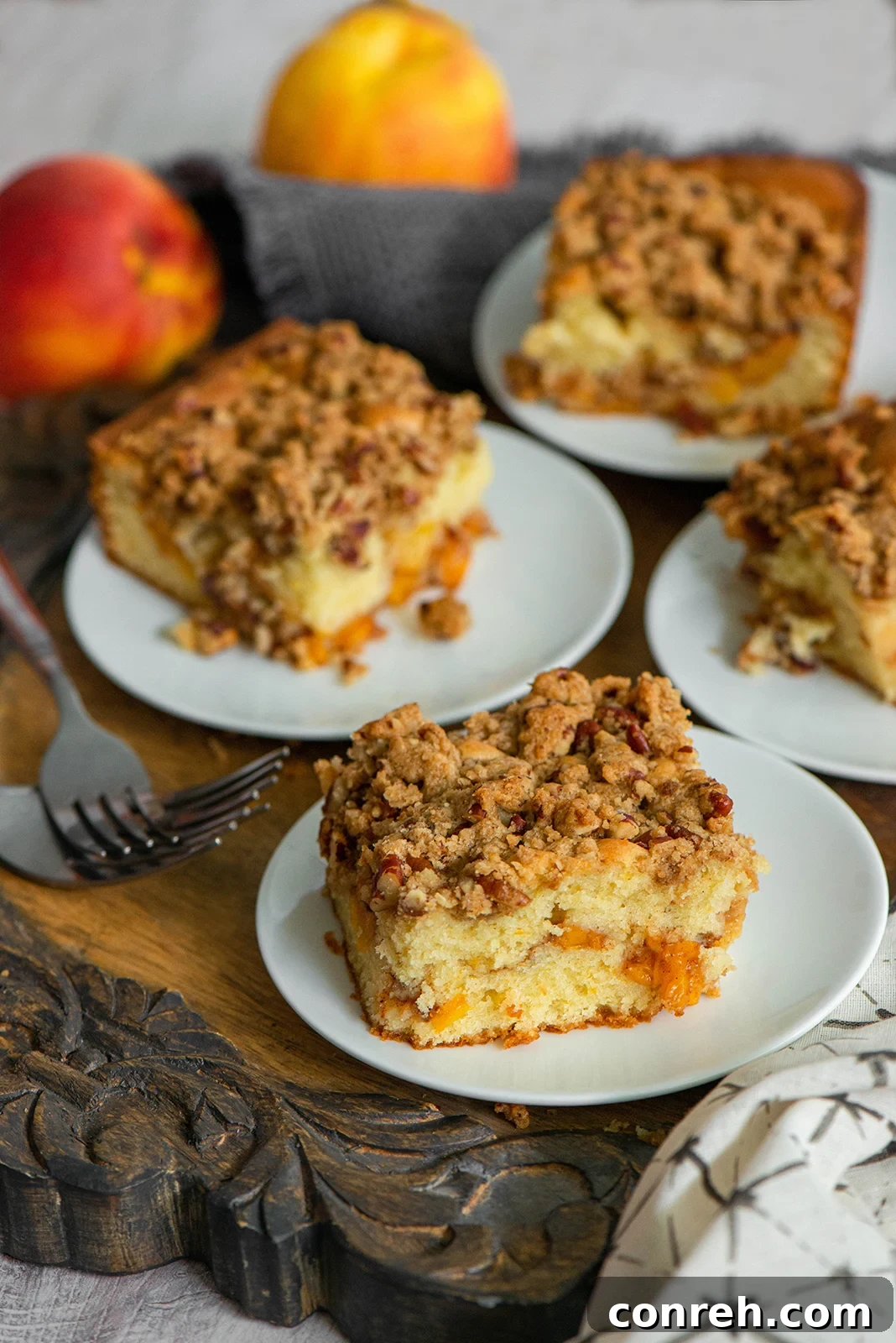 Golden Peach Coffee Cake with Toasted Pecan Crumble 2 Delicious peach coffee cake with pecan streusel, ready for a cozy evening treat.