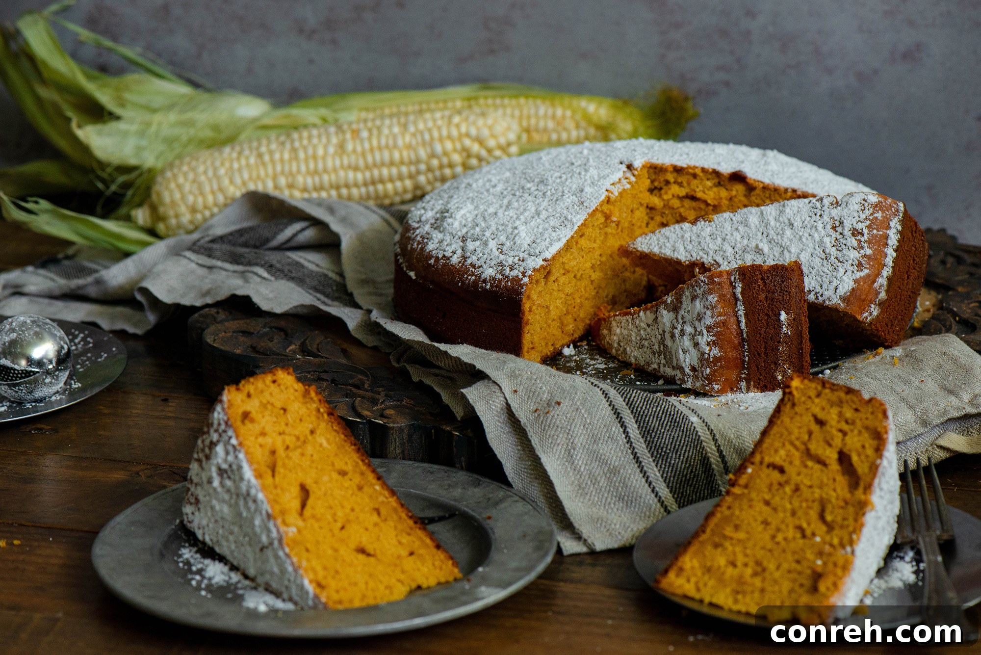 A serving of Pumpkin Corn Cake artfully arranged with a fork, emphasizing its delightful presentation and inviting texture.