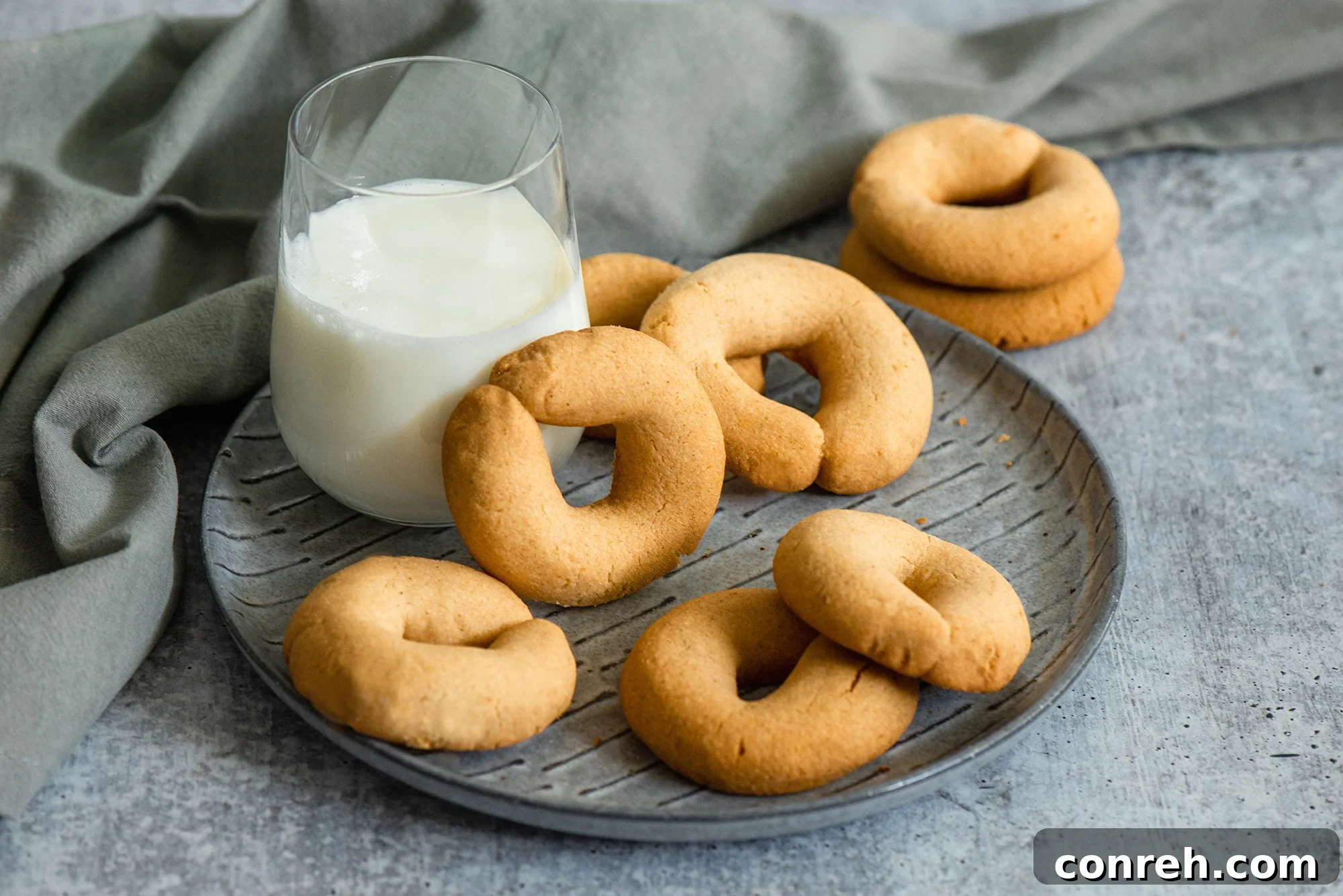 A close-up of a stack of golden brown Coricos, showing their distinctive texture and shape, ideal for a morning treat.