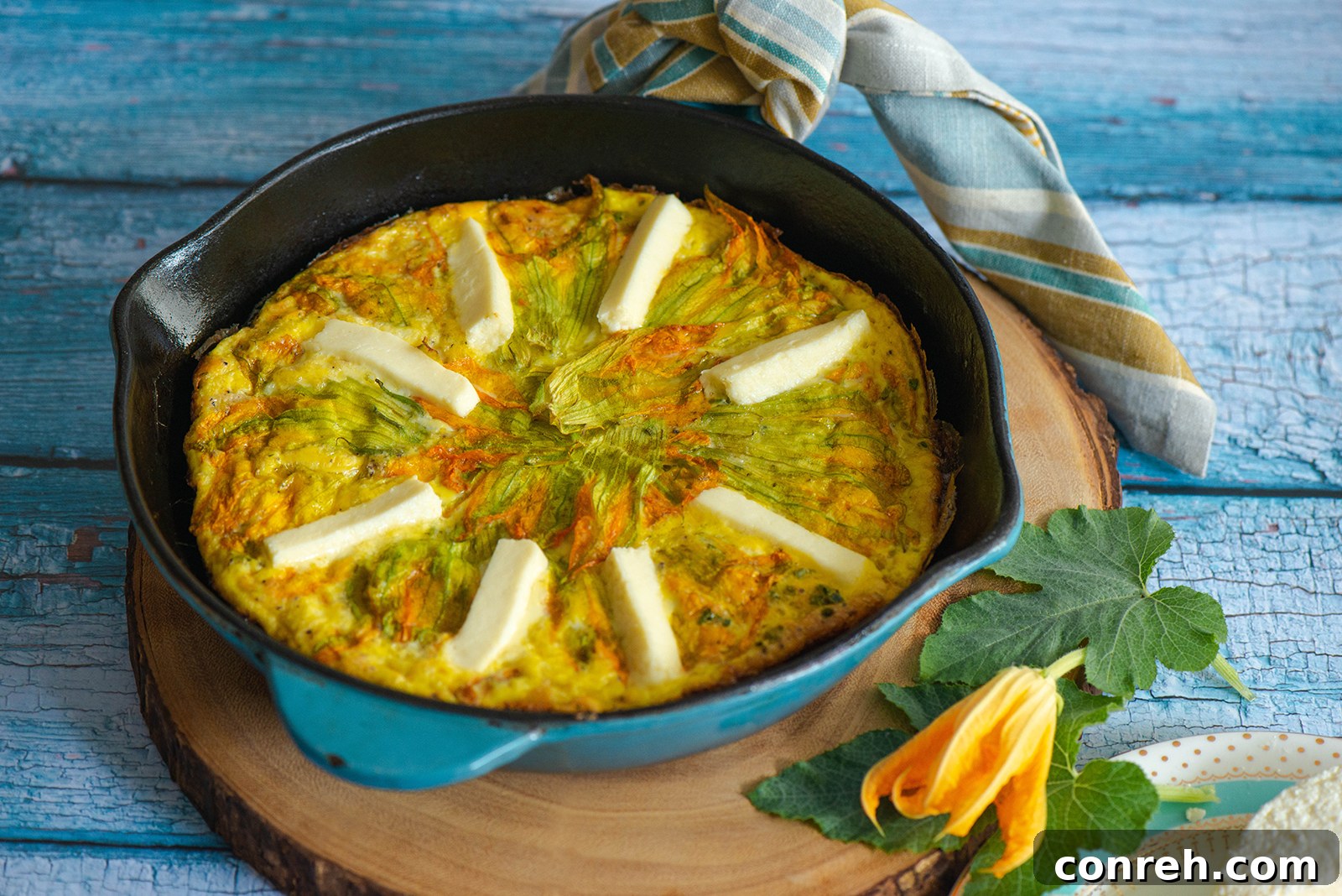 Another perspective of the frittata, highlighting the golden brown crust and fresh garnish.