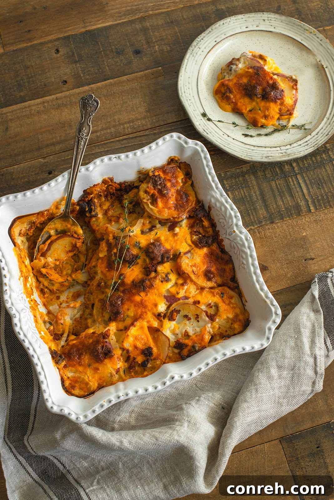 A festive Thanksgiving table setting with a focus on a delicious potato dish.