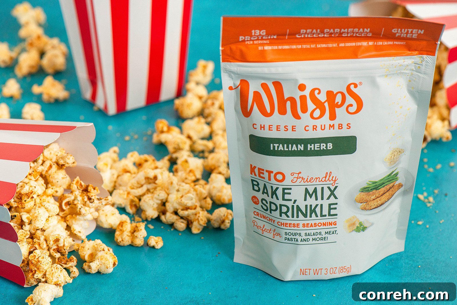 Close-up of freshly popped popcorn seasoned with spices and Whisps Cheese Crumbs