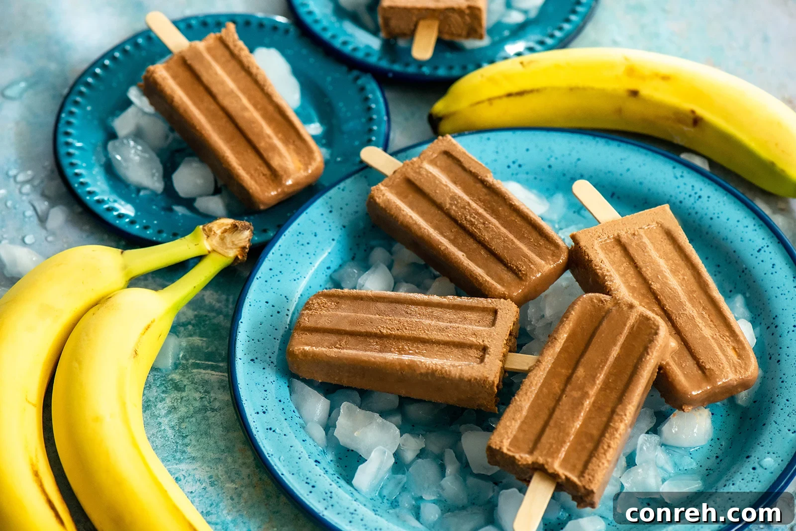 Close-up of frozen banana chocolate popsicles in molds