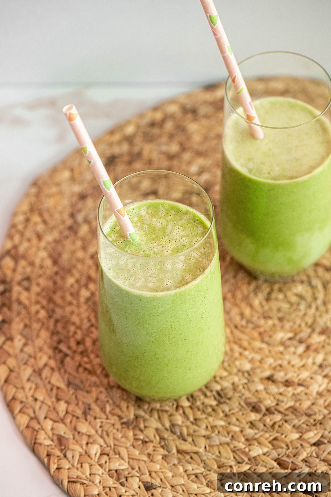 Various smoothie ingredients including fresh spinach, banana, and celery