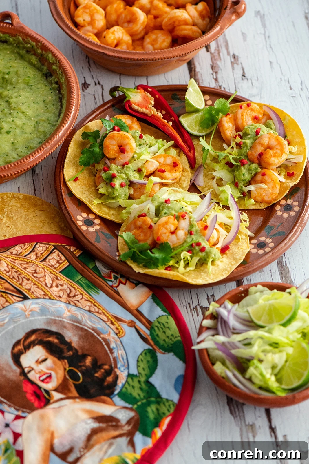 Plump, seasoned shrimp arranged in warm tortillas, topped with fresh cilantro and a dollop of creamy green chile salsa, ready for a game day feast.