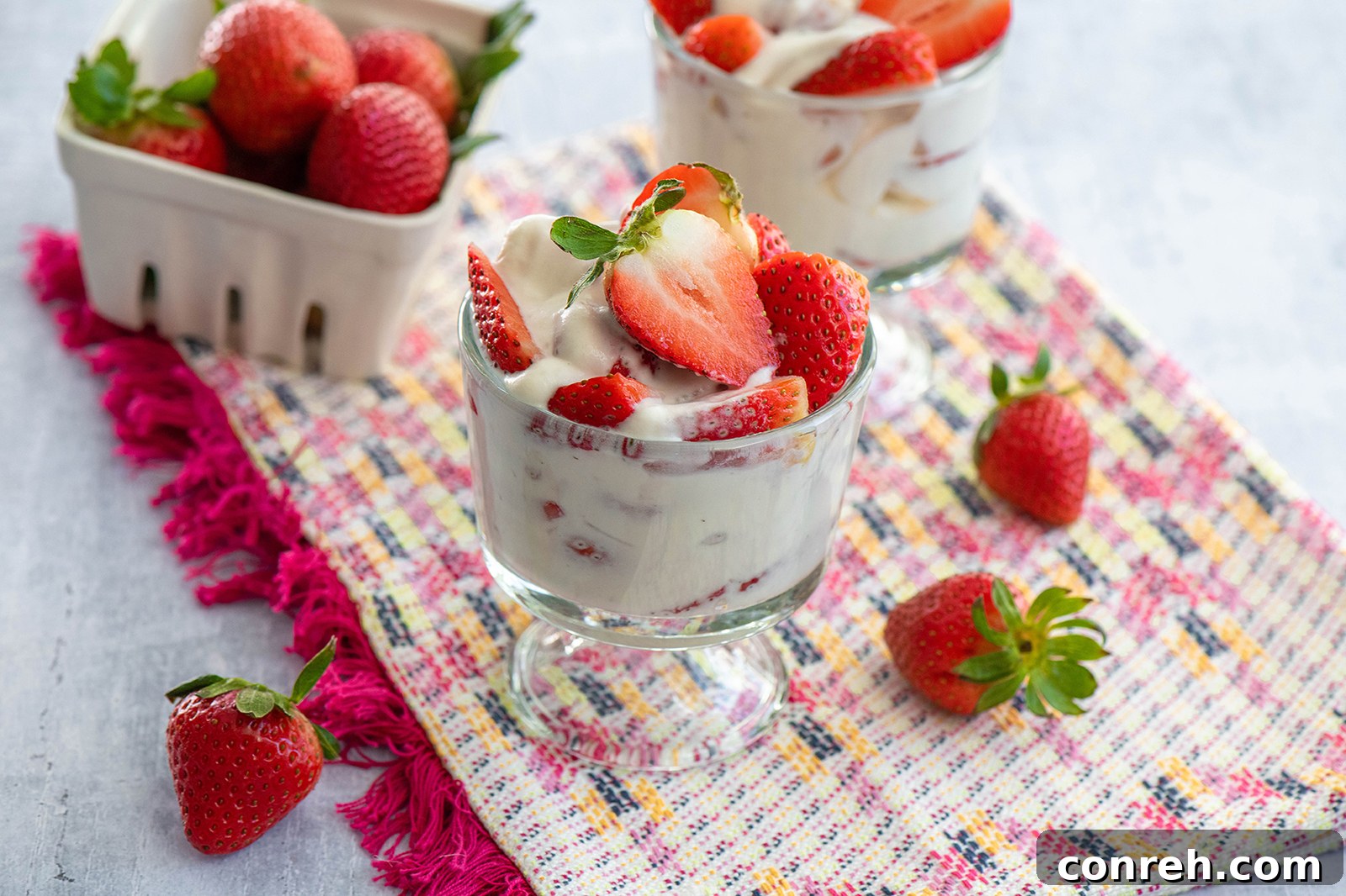 Luscious Strawberries and Cream 3 Close-up of Fresas con Crema, showing the layers of fresh strawberries and fluffy vanilla cream, ready to be enjoyed.