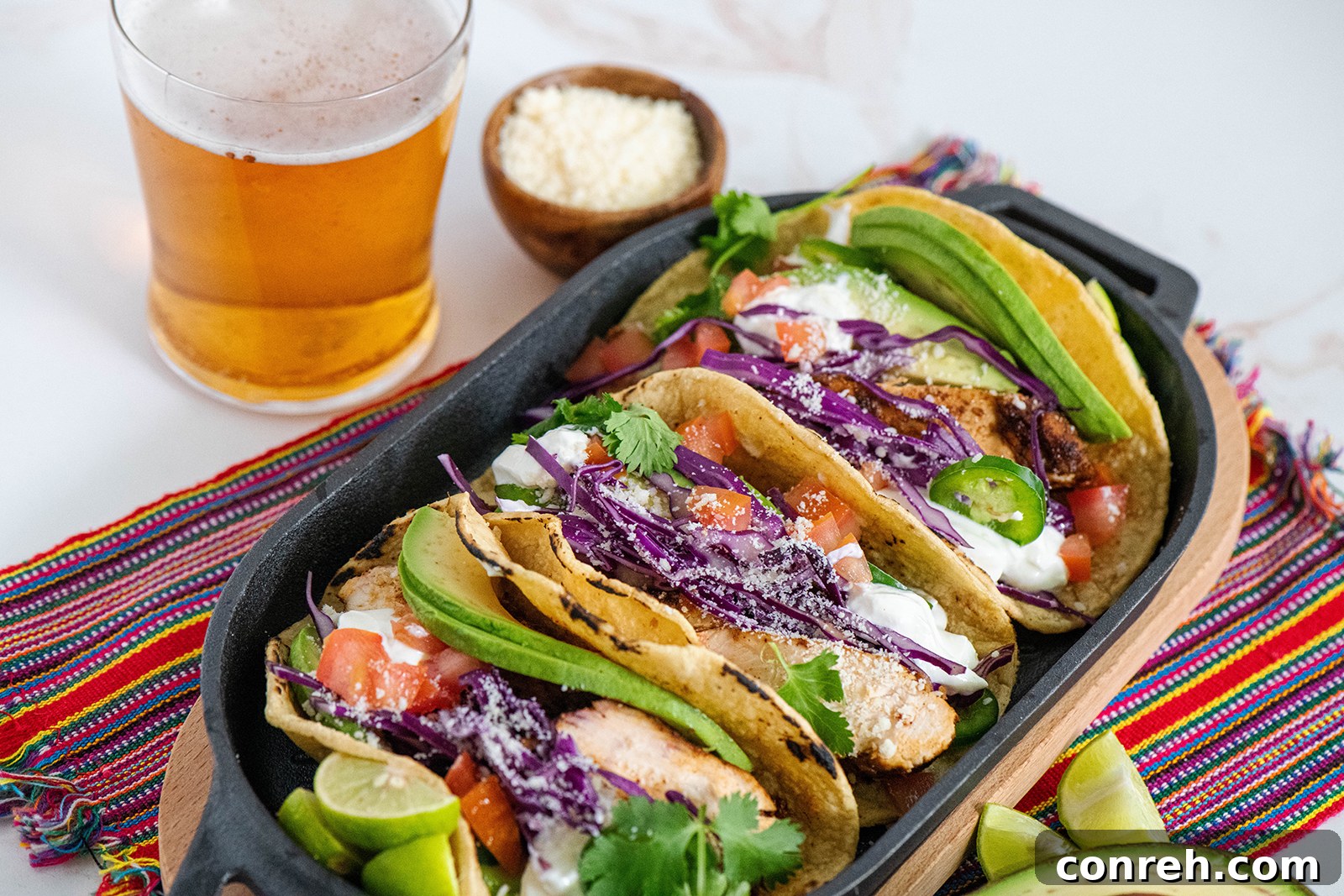 Close-up of a finished Tequila Lime Chicken Taco with fresh toppings