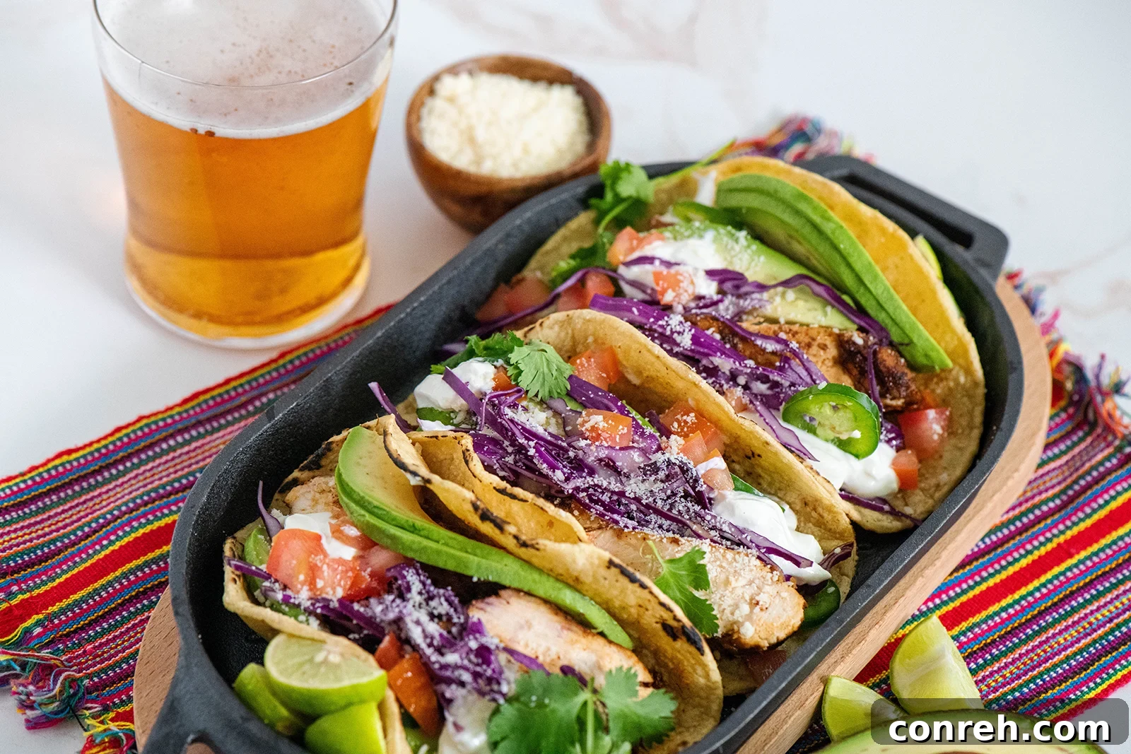 Assortment of Tequila Lime Chicken Tacos with various fresh ingredients