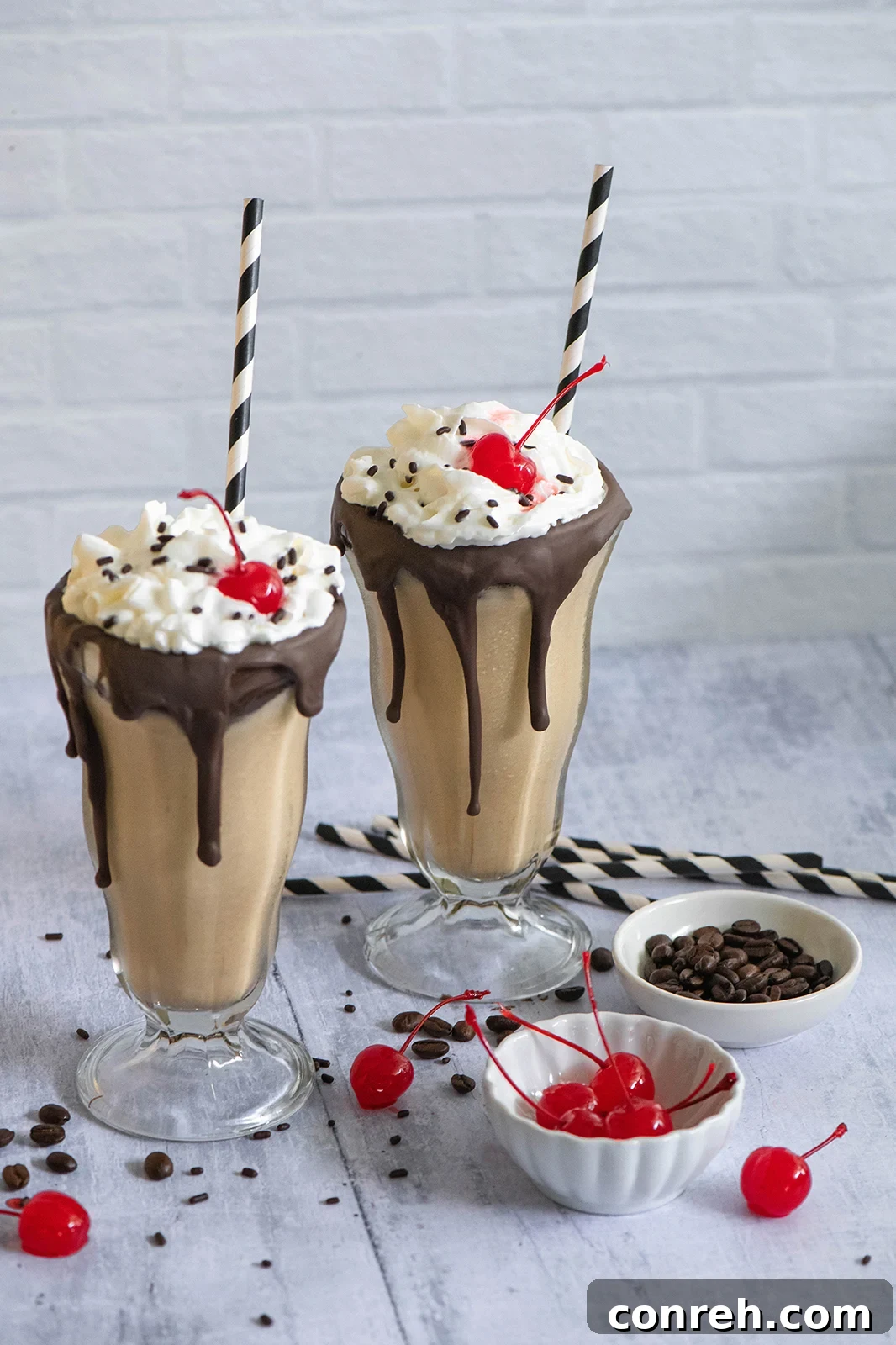 A beautifully prepared Mexican Coffee Milkshake topped with whipped cream and chocolate