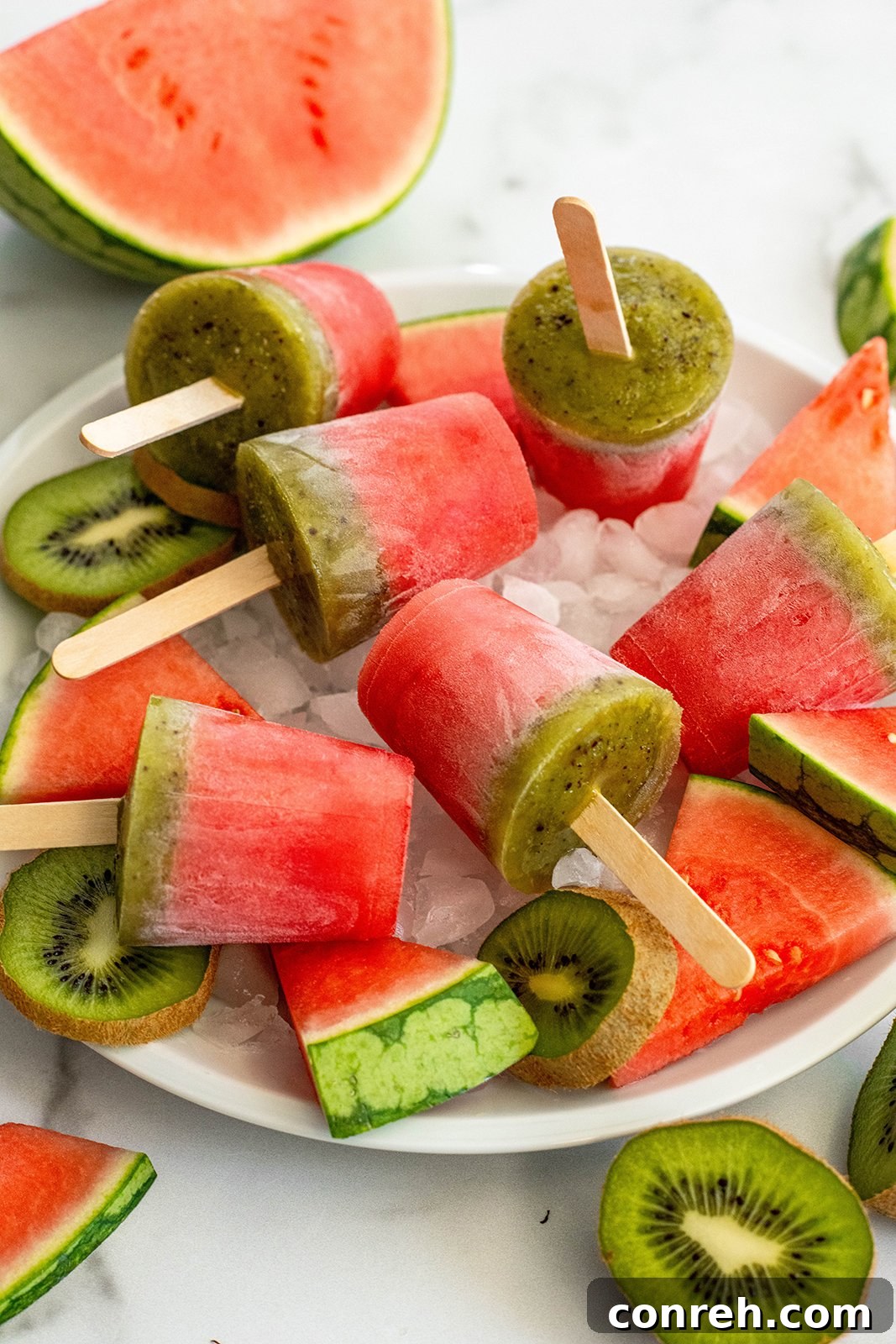 Vibrant Watermelon Kiwi Paletas on a hot summer day