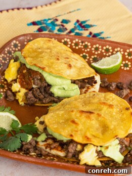 Breakfast mulitas, beautifully arranged on a plate with fresh garnishes.
