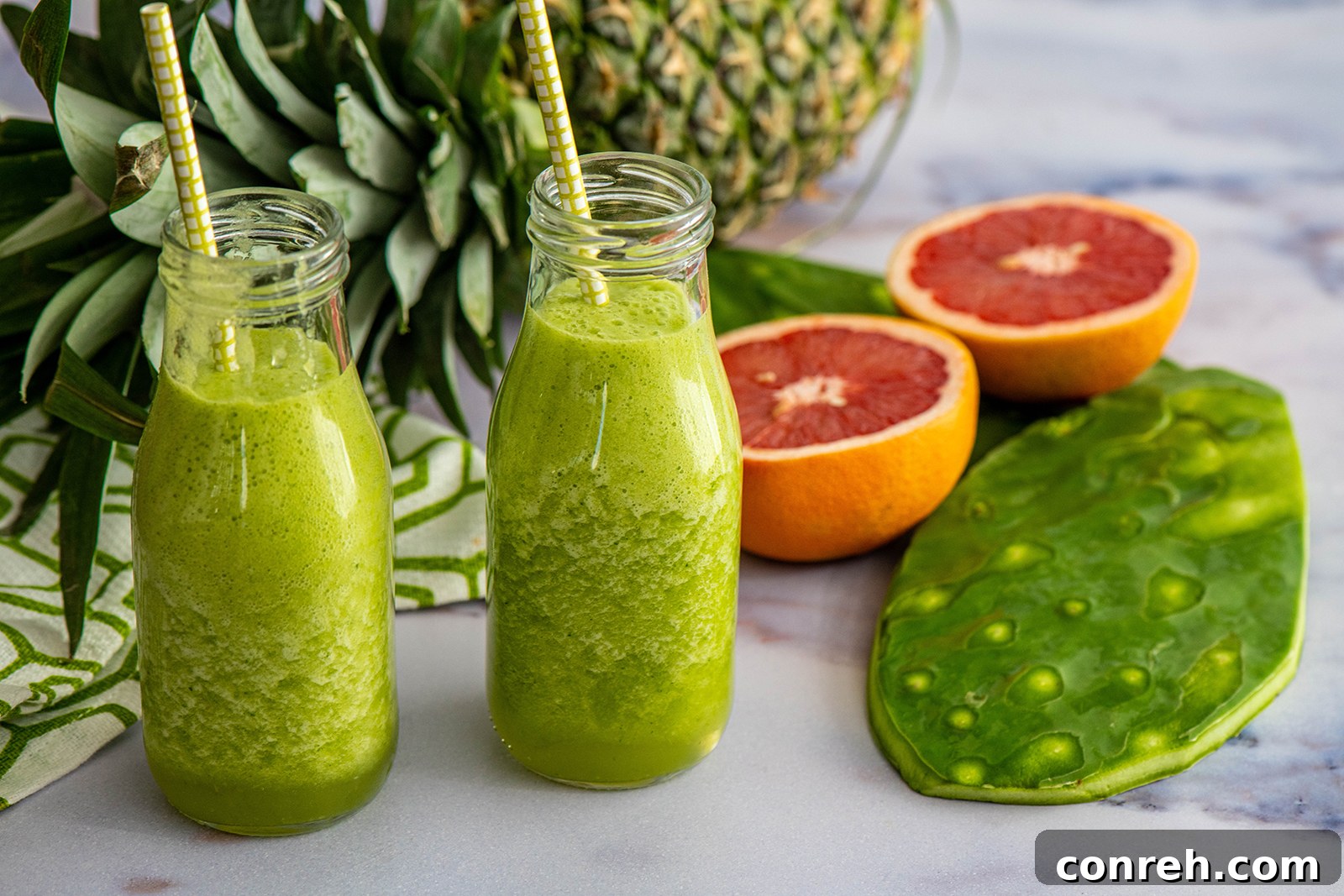 Close-up of fresh celery stalks and a juicing machine