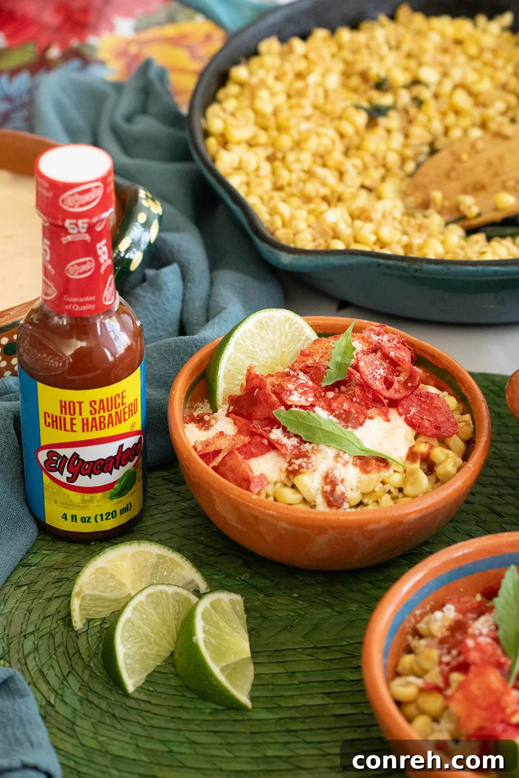 Styled image of Esquites Fuego in a serving cup, garnished