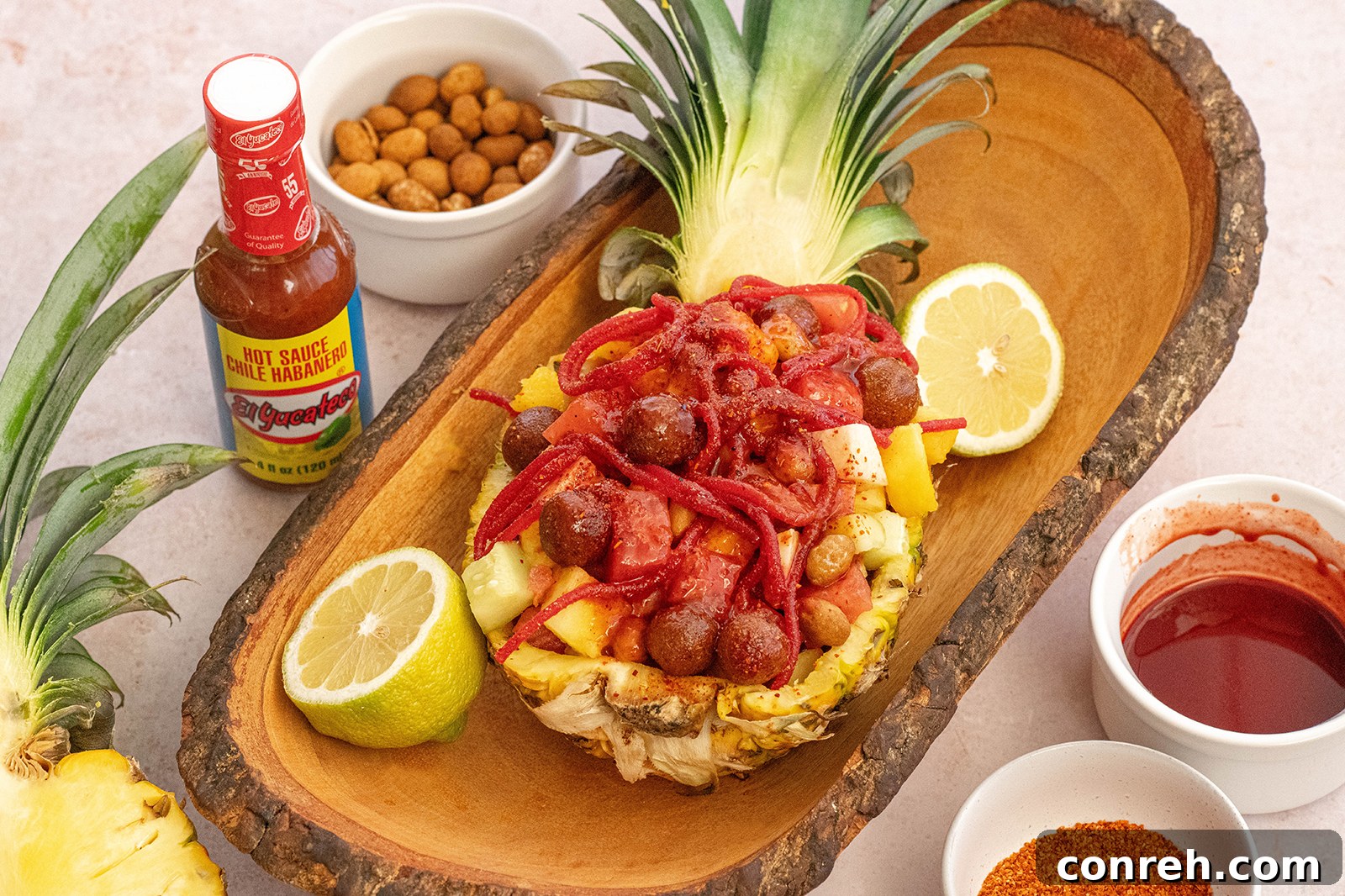 Wild Pineapple 3 Close-up of Piña Loca showcasing the colorful mix of fruits, peanuts, candies, and sauces.