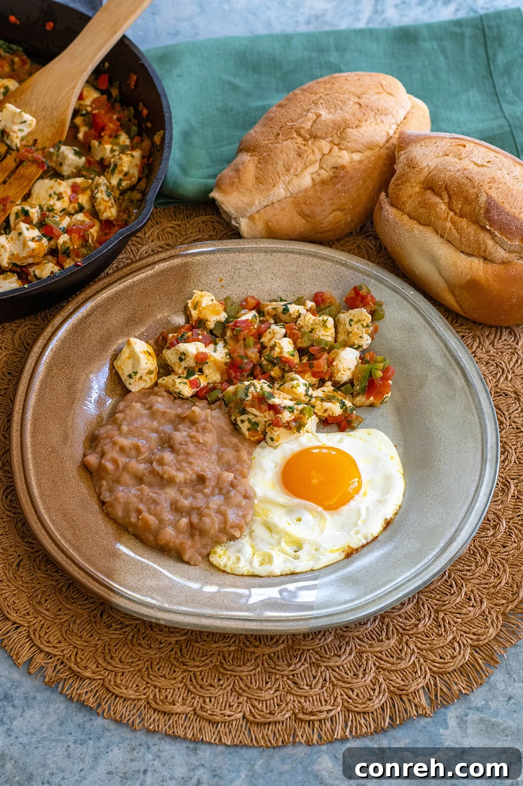 Mexican Panela Cheese 2 Vibrant Panela a la Mexicana breakfast dish with fried egg and refried beans