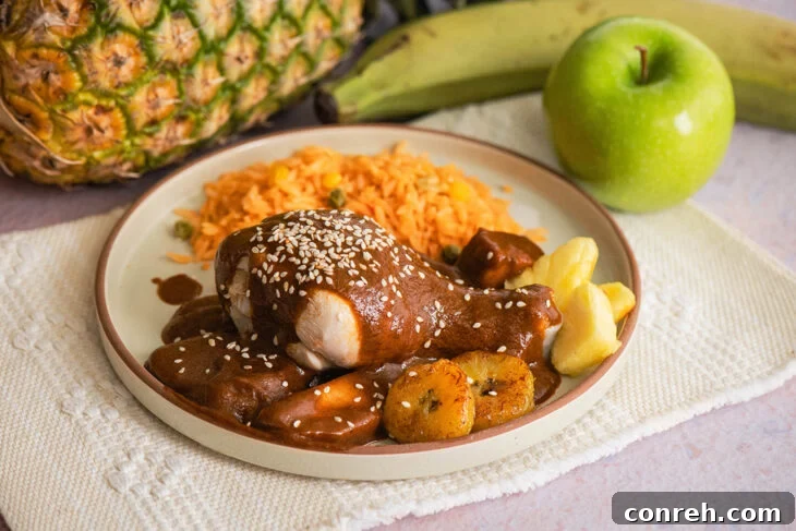 Ingredients for Mole Manchamanteles, including chiles, fruits, and spices