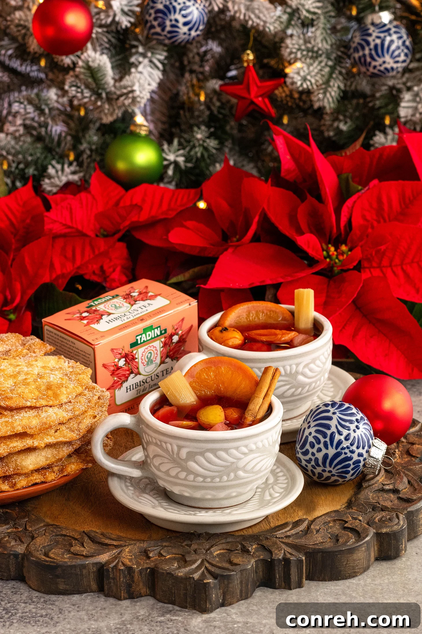 Holiday Cheer Punch 2 Traditional Mexican Ponche Navideño in a large pot with fresh fruits and spices