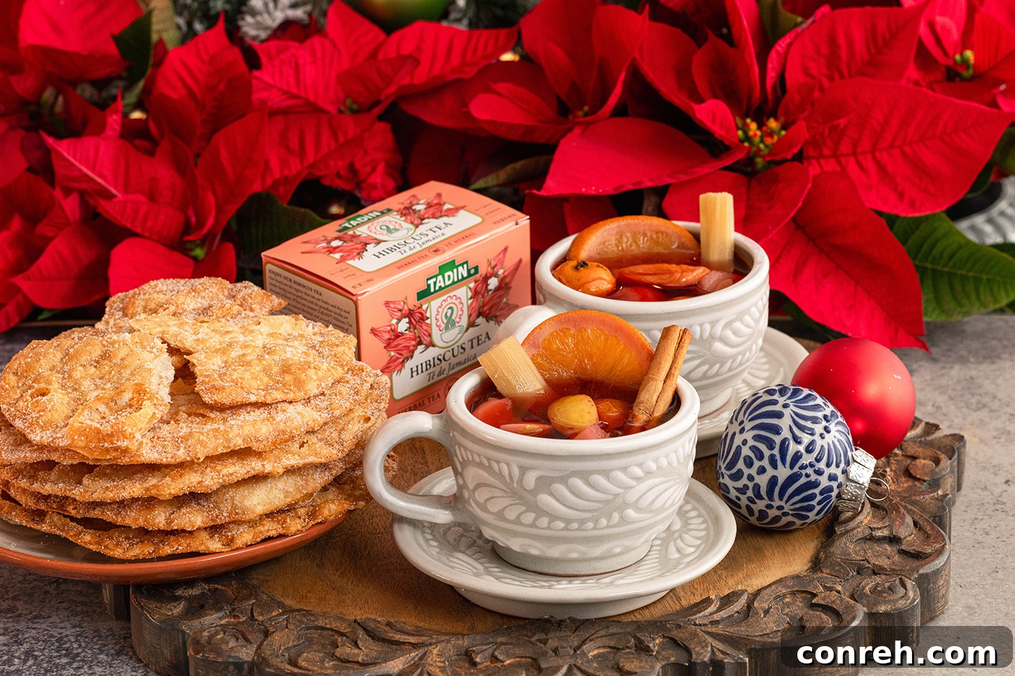 Holiday Cheer Punch 3 Closeup of Ponche Navideño in a traditional clay mug, showing fruits and spices
