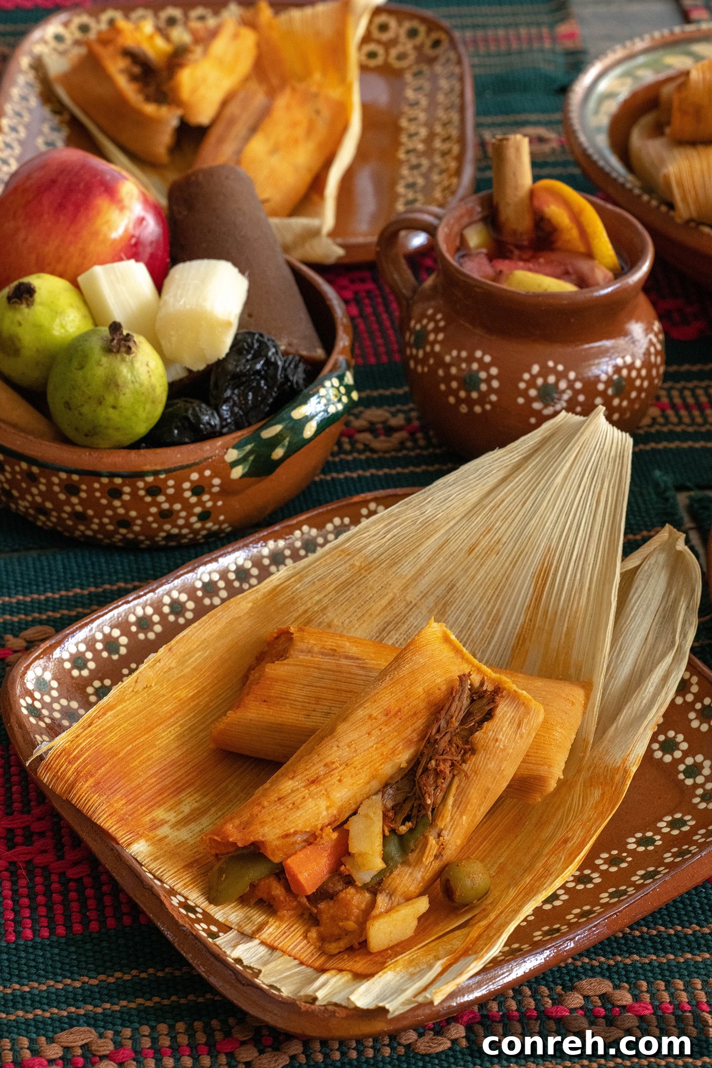 Traditional Red Chile Beef Tamales in corn husks, ready to be steamed