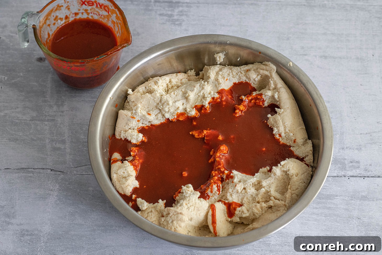 Freshly steamed Red Chile Beef Tamales arranged in a basket, ready to be served