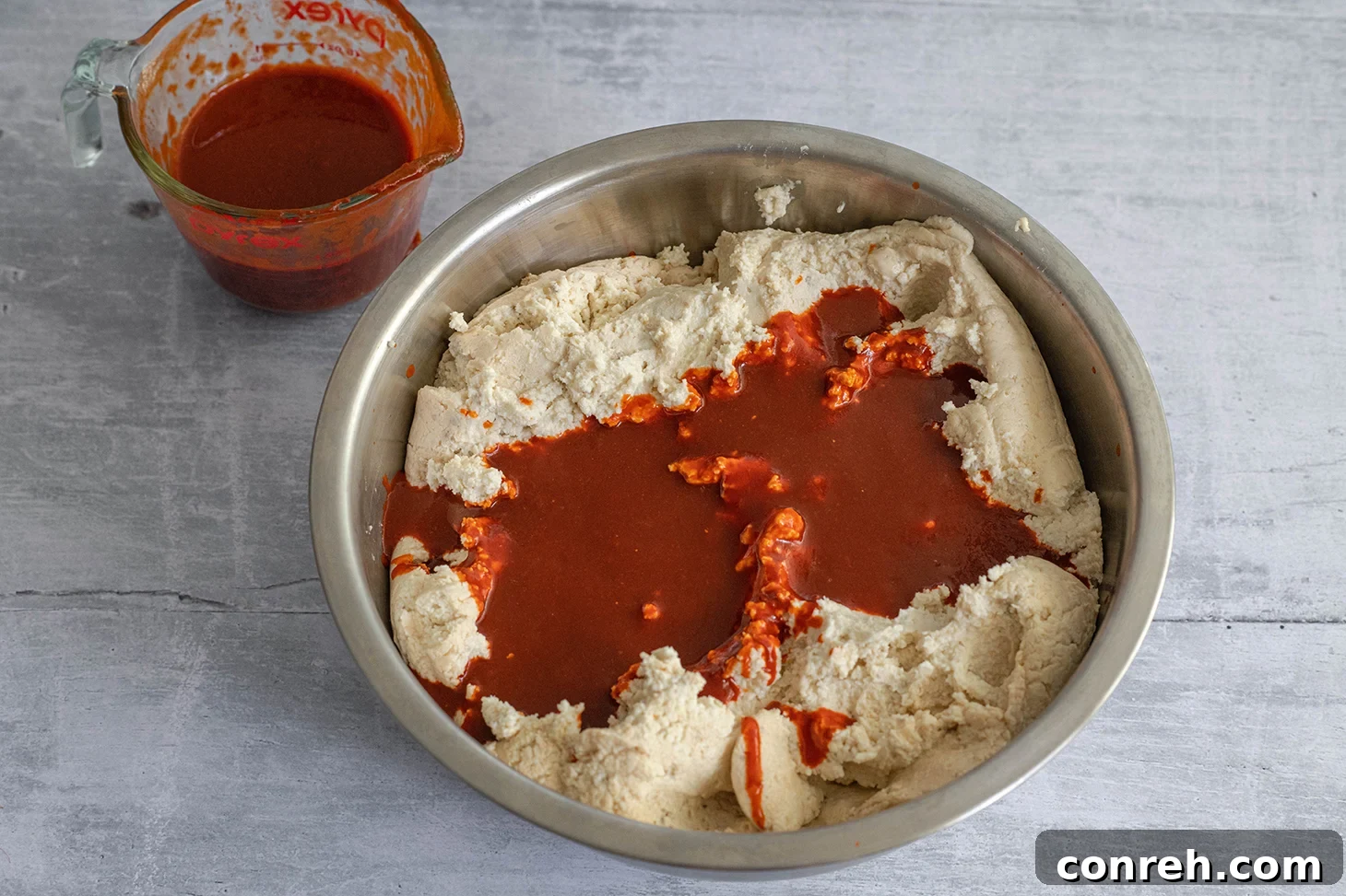 Close-up of a perfectly wrapped tamale ready for steaming