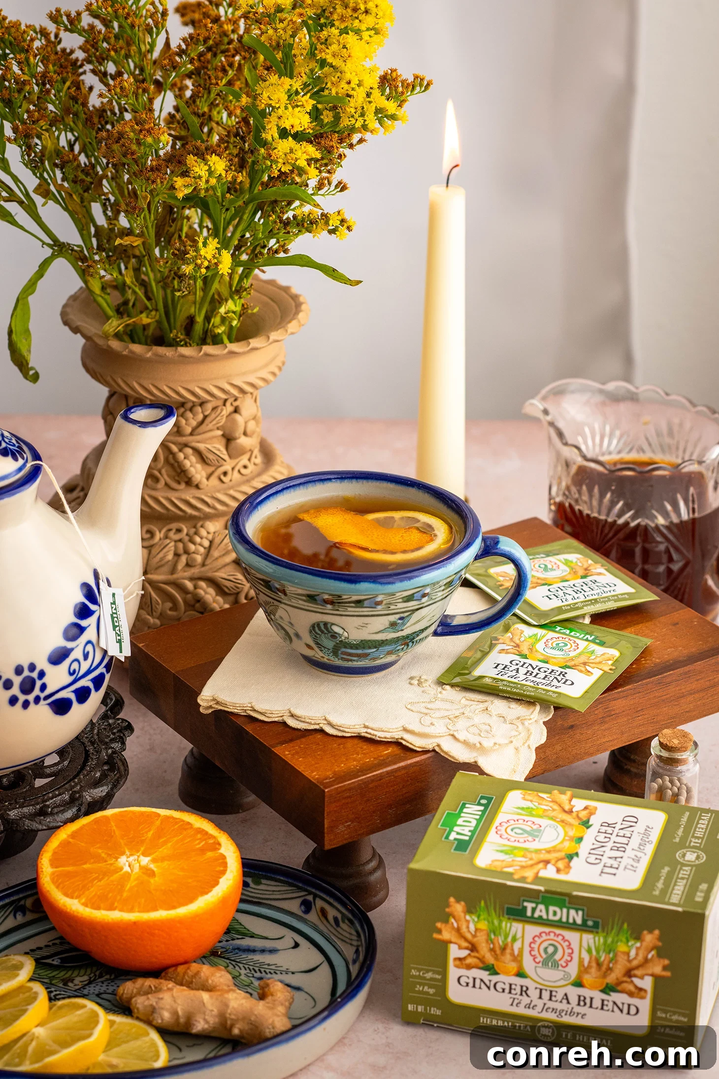 Zesty Piloncillo Ginger Tea 2 A comforting cup of Citrus Ginger Tea with Piloncillo Syrup, garnished with fresh orange slices, cinnamon sticks, and star anise.