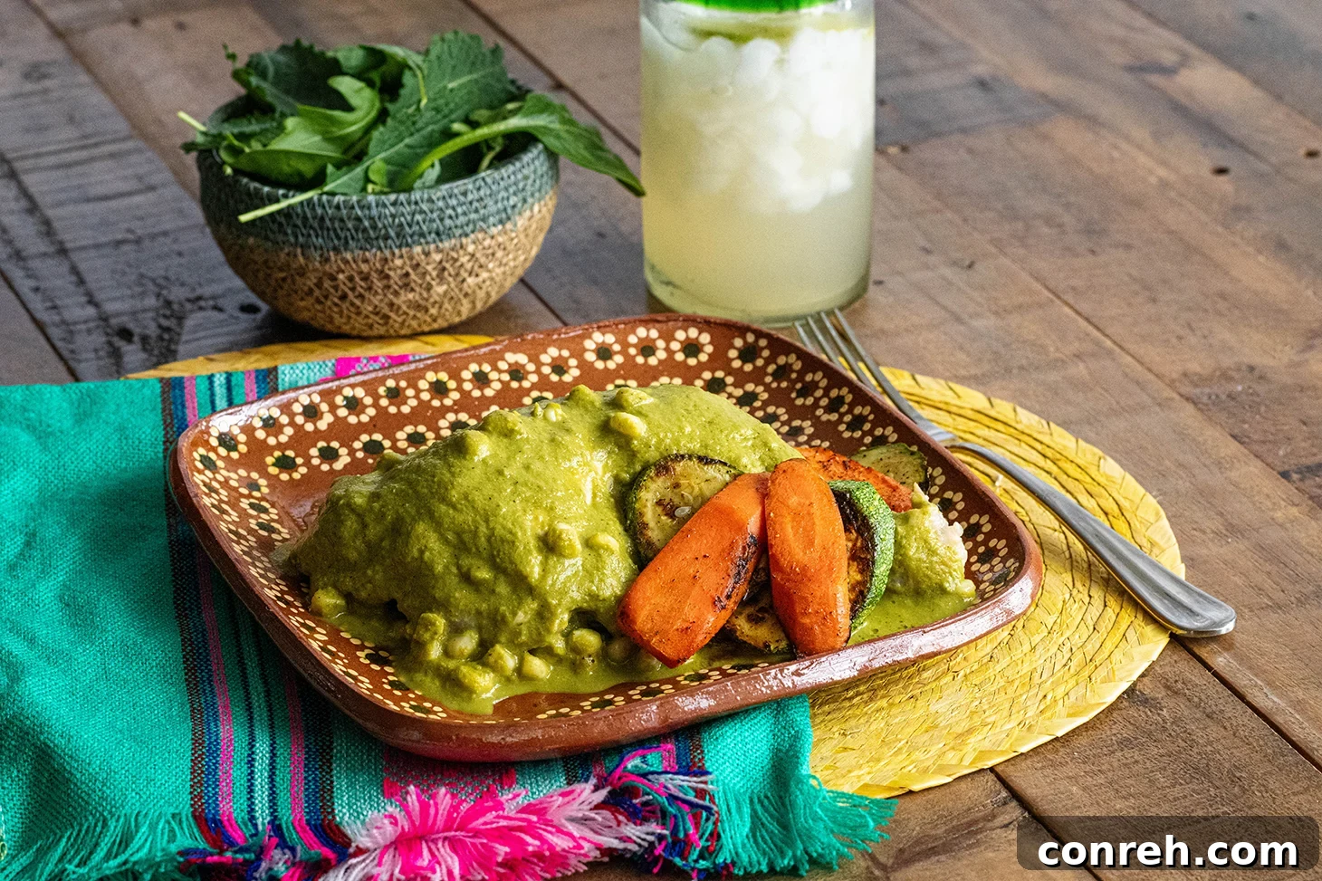 Emerald Atakapua Chicken 3 A close-up view of Chicken Atakapua Verde, showcasing the rich, thick green sauce coating tender pieces of chicken.