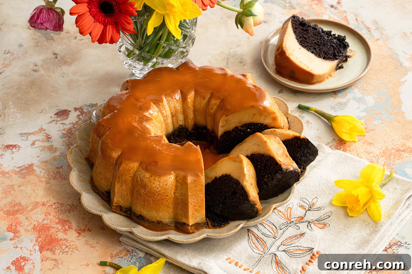 A freshly baked Chocoflan, still in its bundt pan, showcasing the golden caramel top before inversion.