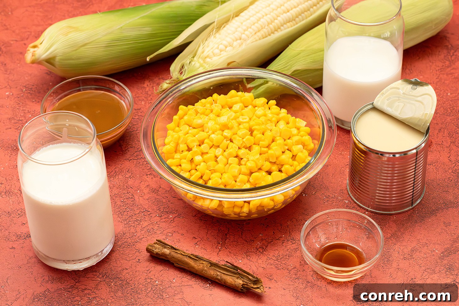 A scoop of Corn Ice Cream with a spoon on a rustic wooden surface