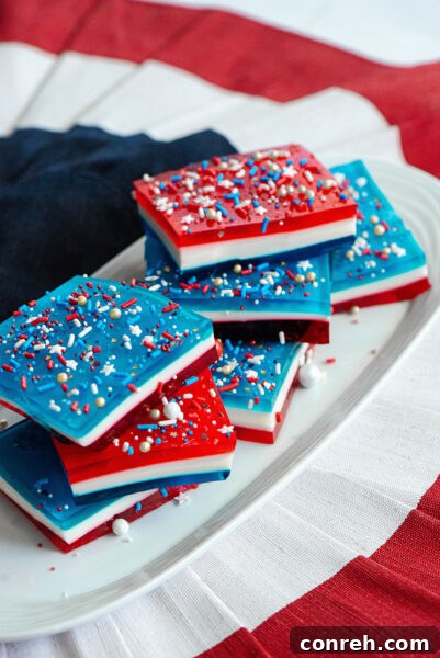 Red White and Blue Gelatina Squares, a refreshing and patriotic dessert for summer celebrations.